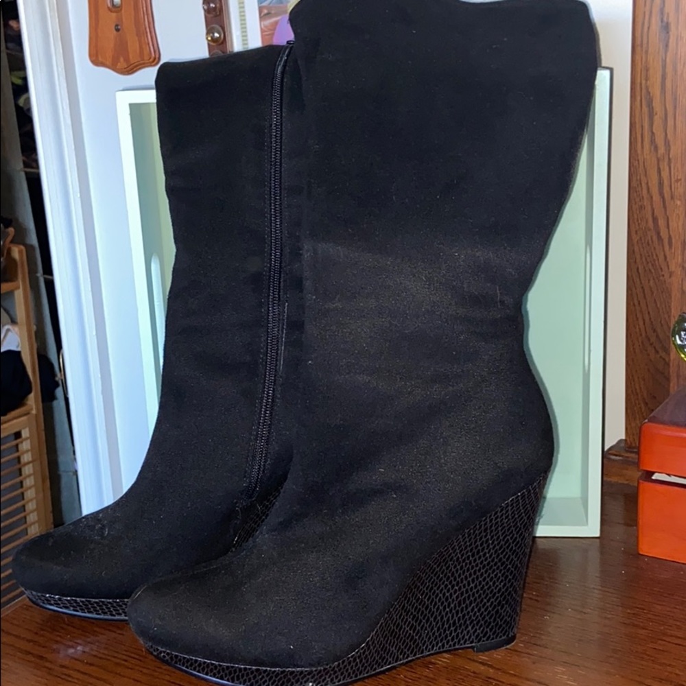 Knee high black stretch boots.